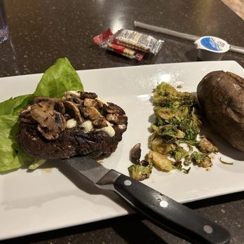 Cora's Creekside Tavern - Delicious filet! SALTYYYYYY Brussels sprouts, and baked potato. - New American Near Me - Burnham, Pennsylvania