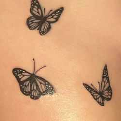 Mister Finster's Tattoo & Body Piercing - Ribcage butterfly tattoos