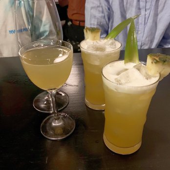 Tonari - Not a "painkiller" (2 drinks with pineapple on the right), Hello limoncello (left) - Japanese Near Me - Washington, DC, District of Columbia Tonari - Not a "painkiller" (2 drinks with pineapple on the right), Hello limoncello (left) - Japanese Near Me - Washington, DC, District of Columbia