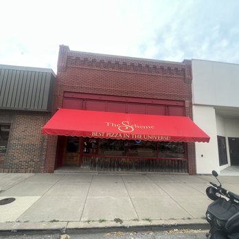 Scheme Restaurant Bar - a scooter parked in front of the restaurant - Pizza Near Me - Salina, Kansas