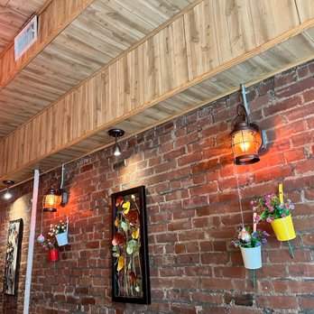 Masala Grill - a brick wall with hanging lights - Indian Near Me - Brooklyn, New York Masala Grill - a brick wall with hanging lights - Indian Near Me - Brooklyn, New York