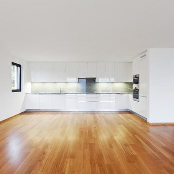 Jeremiah's Handyman Service - an empty kitchen with hardwood floors - Plumbing Near Me Jeremiah's Handyman Service - an empty kitchen with hardwood floors - Plumbing Near Me