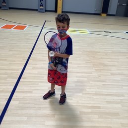 My son enjoying badminton. My son enjoying badminton.