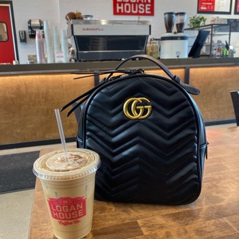 Logan House Coffee - a handbag and a cup of coffee - Coffee & Tea Near Me - Denver, Colorado