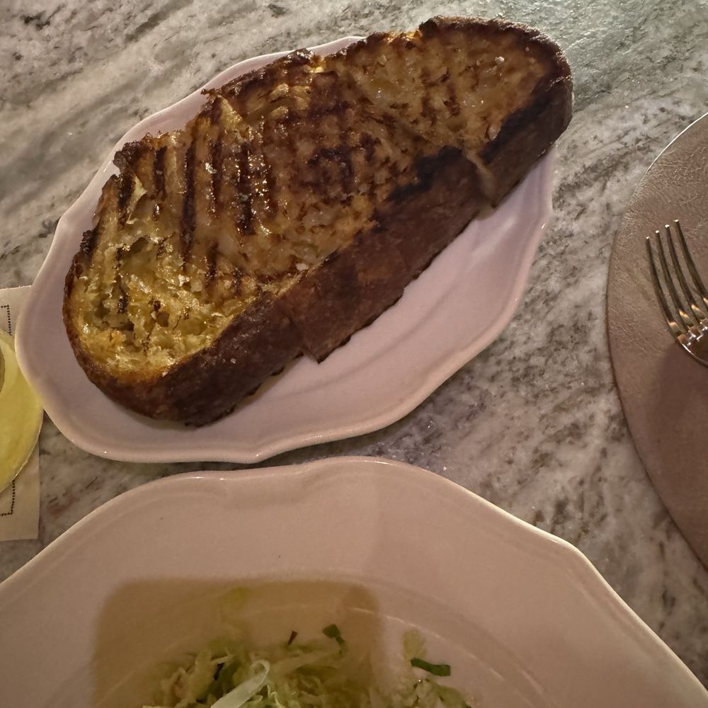 Fett'unta grilled bread, garlic, extra-virgin olive oil Fett'unta grilled bread, garlic, extra-virgin olive oil