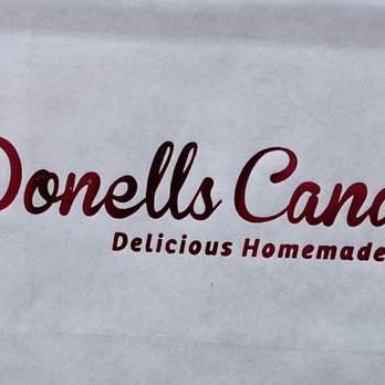 Donells Candies - a woman holding a donut - Candy Stores Near Me - Casper, Wyoming Donells Candies - a woman holding a donut - Candy Stores Near Me - Casper, Wyoming
