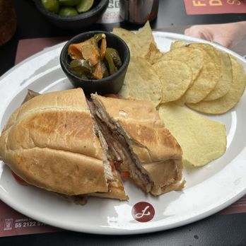 El Farolito Tecamachalco - Cuban sandwich (part removed) with chips and peppers - Restaurants Near Me - México, MEX