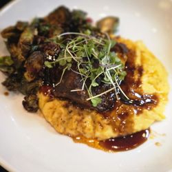 Curtain Call Lounge - Braised Short Ribs over grits, with brussel sprouts topped with bacon