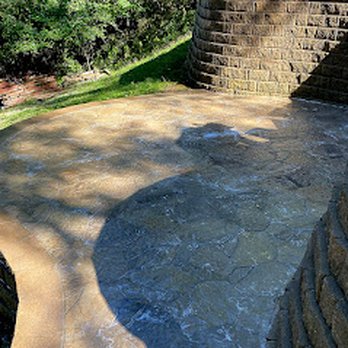 5 Sons Naturescapes - a stone patio with a brick wall - Landscaping Near Me - Winterset, Iowa