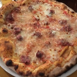 Nuova Pizzeria Bruna - Sausage pizza-thin crust, great sauce, we finished the whole pizza.