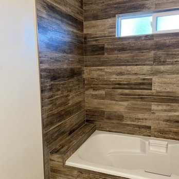 Tileshop - a bathtub and window in a bathroom - Building Supplies Near Me - San Jose, California