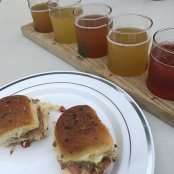 Tapped Apple Hard Cider - A refreshing flight alongside muffuletta I brought - Breweries Near Me - Salida, California