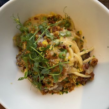 Il Lusso - Half order of Bucatini alla Carbonera pasta at Il Lusso - this dish has panceta, English peas, parmesan, and herbs. - Steakhouses Near Me - Tallahassee, Florida