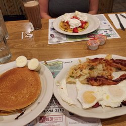 Country Squire Restaurant - Farmer's breakfast, chocolate chip pancakes with whipped cream and strawberries, chocolate milk