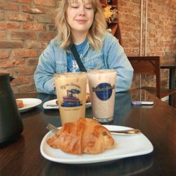 Fulton Yards Coffeehouse & Spirits - A ham and gruyère croissant, an iced latte, and an iced chai for here