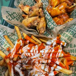 Louisiana voodoo fries, lemon pepper and mango habanero wings Louisiana voodoo fries, lemon pepper and mango habanero wings