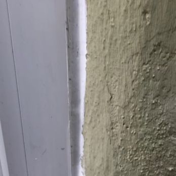 CCI Construction - Too much of the vinyl trim was cut off resulting in uneven and excess Caulk. - General Contractors Near Me - San Jose, California
