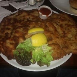 Biggest schnitzel I have ever seen. Only ate half. Delicious Biggest schnitzel I have ever seen. Only ate half. Delicious