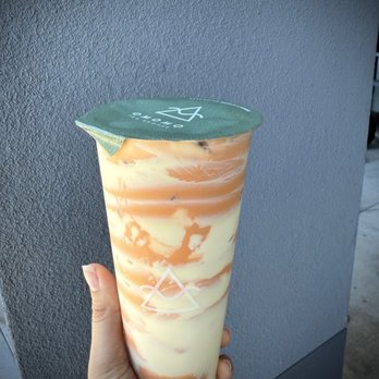 OMOMO Tea Shoppe - Camo Thai: Thai iced milk tea poured into a sweet caramel brûlée cup - Bubble Tea Near Me - Brea, California OMOMO Tea Shoppe - Camo Thai: Thai iced milk tea poured into a sweet caramel brûlée cup - Bubble Tea Near Me - Brea, California