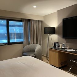 Hotel Hilton - Guest room with interior atrium view.