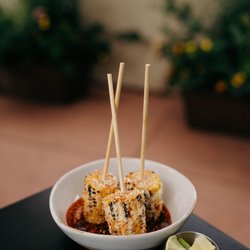 Rio Grande Mexican Restaurant - Enjoy a summer favorite with Rio Grande's Elote, featuring fire-grilled Olathe corn topped with creamy mayo, queso cotija, an...