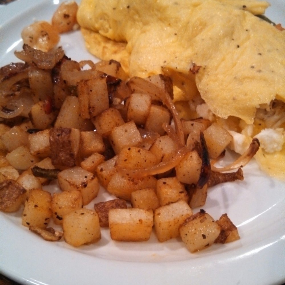 Crab and Shrimp Omelette with home fries. Crab and Shrimp Omelette with home fries.
