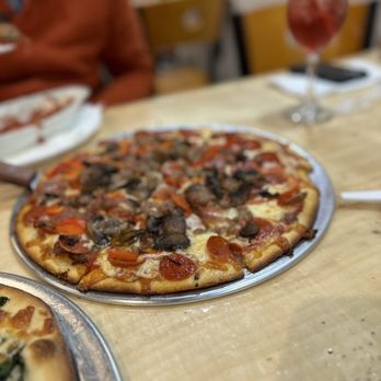 Angeli's Pizzeria - two pizzas on a table - Pizza Near Me - Baltimore, Maryland Angeli's Pizzeria - two pizzas on a table - Pizza Near Me - Baltimore, Maryland