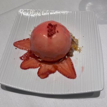 Sage Student Bistro - a strawberry dessert on a white plate - New American Near Me - Omaha, Nebraska
