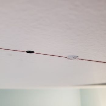 Thors Hammer Construction - One example of a screw (first contractor) popping out due to the force and vibration of Troy securing the sheetrock with longer screws. - General Contractors Near Me Thors Hammer Construction - One example of a screw (first contractor) popping out due to the force and vibration of Troy securing the sheetrock with longer screws. - General Contractors Near Me