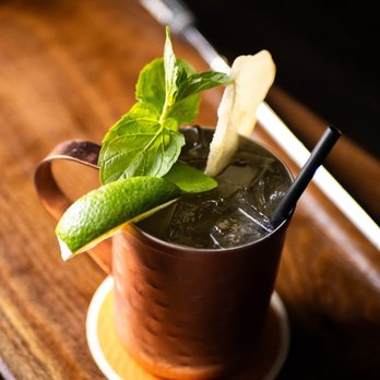 Brews N Birdies - The Mulligan Mule -- A mezcal and chili liqueur take on the classic cocktail, garnished with lime, mint, and candied ginger. - Golf Near Me - Denver, Colorado Brews N Birdies - The Mulligan Mule -- A mezcal and chili liqueur take on the classic cocktail, garnished with lime, mint, and candied ginger. - Golf Near Me - Denver, Colorado