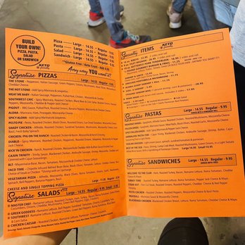 Hot Stone - a person holding a menu in their hand - Pizza Near Me - Wynne, Arkansas