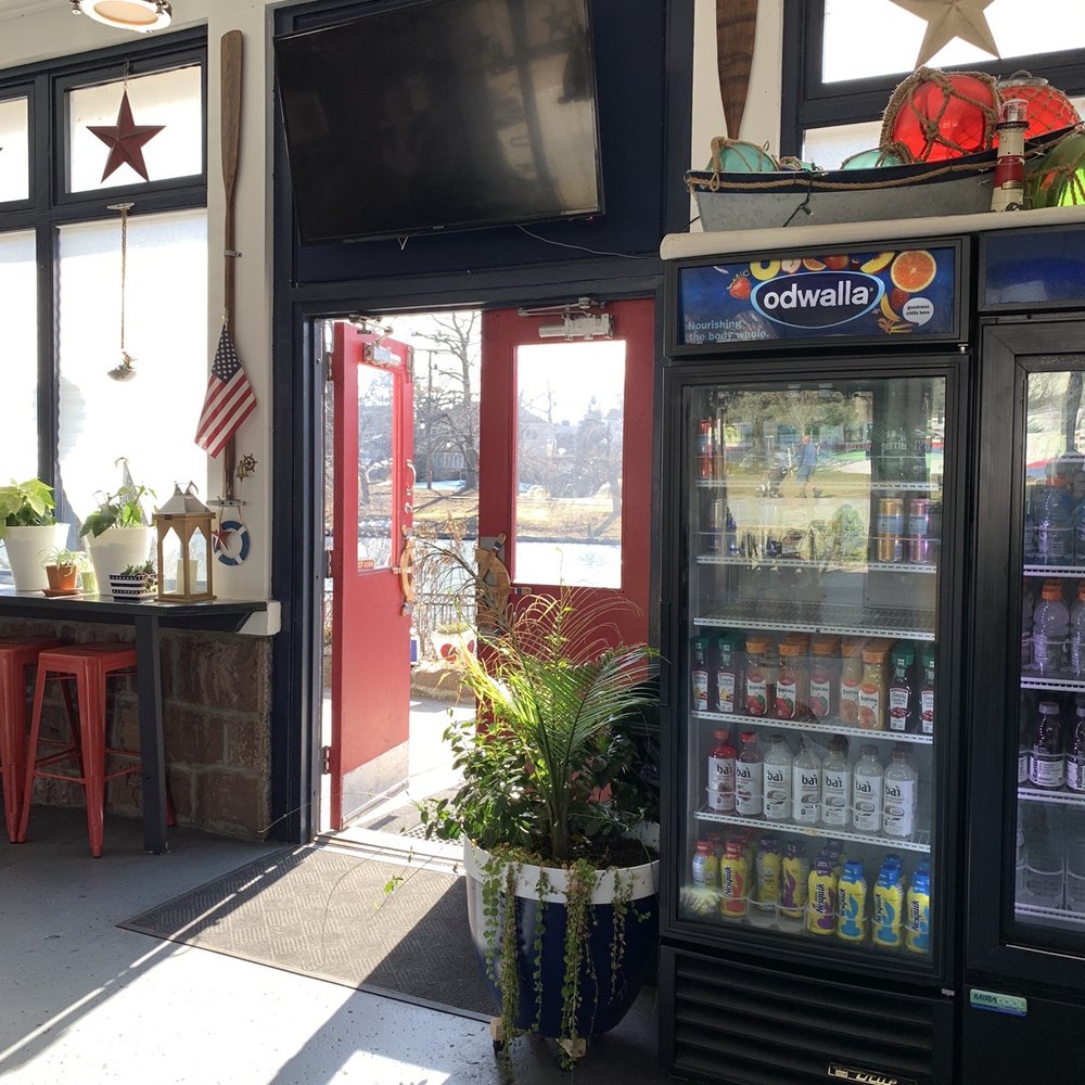 Boathouse Cafe - Door by the outdoor seating area. The counter is to the right of the drinks. - Cafes Near Me - Passaic, New Jersey