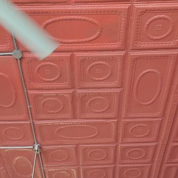 The Ashen Rose - a man in a red room with a ceiling fan - Pubs Near Me - Greenville, Texas The Ashen Rose - a man in a red room with a ceiling fan - Pubs Near Me - Greenville, Texas