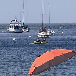 Trainer and student in kayaks near the wharf in Monterey. Trainer and student in kayaks near the wharf in Monterey.