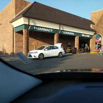 Schnucks Arsenal - a car parked in front of a pharmacy - Grocery Near Me - St. Louis, Missouri