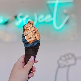KURIMU - charcoal soft-serve ice cream with gold foil in a chocolate cone - Bubble Tea Near Me - Chicago, Illinois KURIMU - charcoal soft-serve ice cream with gold foil in a chocolate cone - Bubble Tea Near Me - Chicago, Illinois