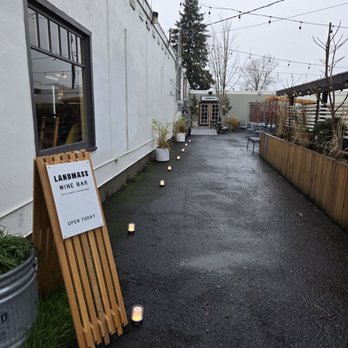 Landmass Wines - Little candlelights guiding you to the entrance of Landmass Wines tasting room on Fremont street - Wine Tasting Room Near Me - Portland, Oregon Landmass Wines - Little candlelights guiding you to the entrance of Landmass Wines tasting room on Fremont street - Wine Tasting Room Near Me - Portland, Oregon