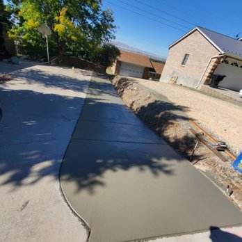 Rusty Wood Construction - a driveway being poured with concrete - Tree Services Near Me Rusty Wood Construction - a driveway being poured with concrete - Tree Services Near Me