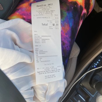RaceTrac - a receipt in the passenger seat of a car - Convenience Stores Near Me - Baton Rouge, Louisiana