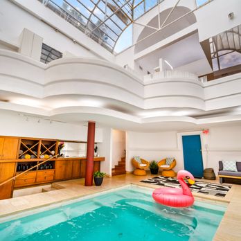 Lodgewell - Built in 1882 and reimagined in 1985 The Graeber indoor pool with glass ceiling highlights a century of incredible architure in one room. - Vacation Rentals Near Me - Austin, Texas Lodgewell - Built in 1882 and reimagined in 1985 The Graeber indoor pool with glass ceiling highlights a century of incredible architure in one room. - Vacation Rentals Near Me - Austin, Texas