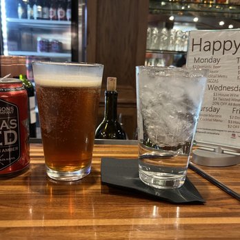 Twisted Fork Grill & Lounge - a glass of beer and a can of beer - Pizza Near Me - Texarkana, Texas Twisted Fork Grill & Lounge - a glass of beer and a can of beer - Pizza Near Me - Texarkana, Texas