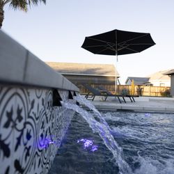 Poseidon Custom Pools - Modern pool, infinity spa, patio cover, sunken fire pit and outdoor kitchen