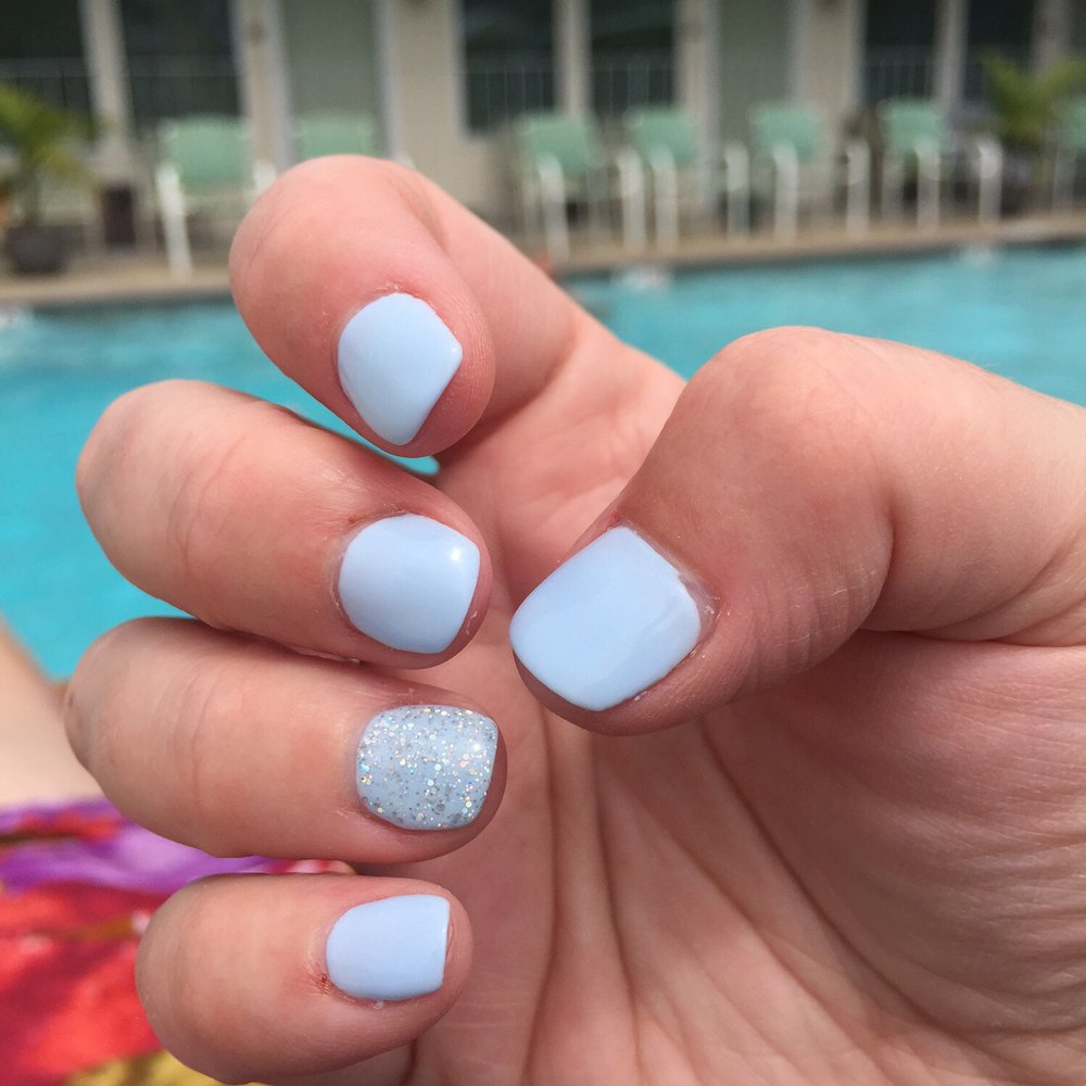 Light blue gel mani with holo accent nail.