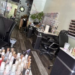 After Hour Nails and Spa - Nail area. Pedicure chairs in back