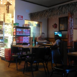 Right side upon entry... you can see a few of the dining booths and the little televisions at each one.