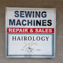 M+T Sewing Machines - A sign...we are in the same building as Hairology Salon.