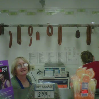 European Gourmet - Choice of Homemade Smoke Kielbasa hanging behind the deli counter - Delis Near Me - Arvada, Colorado