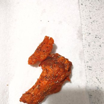 Wingstop - two pieces of chicken on a napkin - Chicken Wings Near Me - Las Vegas, Nevada Wingstop - two pieces of chicken on a napkin - Chicken Wings Near Me - Las Vegas, Nevada