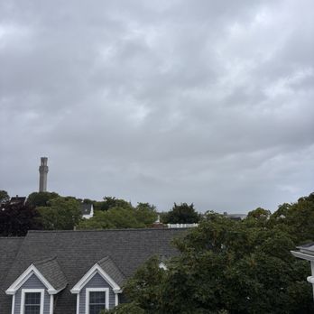 Brasswood Inn - A view of the Pilgrim Monument from the rear balcony of the Fitzgerald penthouse suite. - Hotels Near Me - Provincetown, Massachusetts Brasswood Inn - A view of the Pilgrim Monument from the rear balcony of the Fitzgerald penthouse suite. - Hotels Near Me - Provincetown, Massachusetts