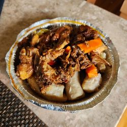 Spring Gardens Jamaican Restaurant - Brown stew chicken and boil banana